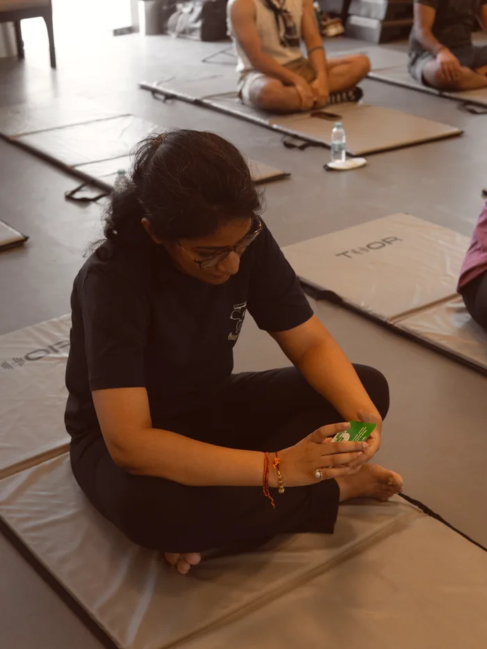 A participant opening her hands after a round of breathwork