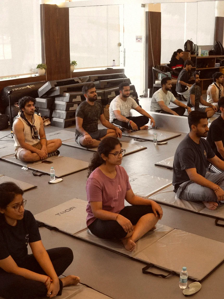 The room from the side, everyone settled on their own mat