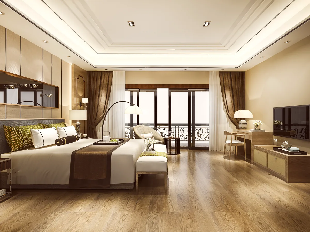 A premium room at Naturoville, made up in white and warm wood